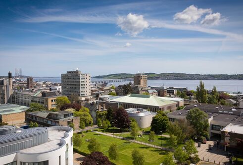The campus green from the top of Belmont Tower. Looking over the city to the river Tay.