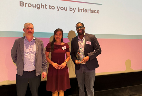 Dr Ify Mordi and colleagues with their award on stage