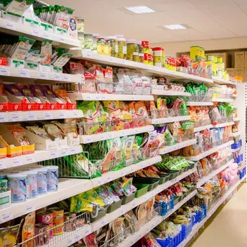 Student in supermarket aisle
