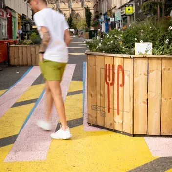 Student walking in Dundee city centre 