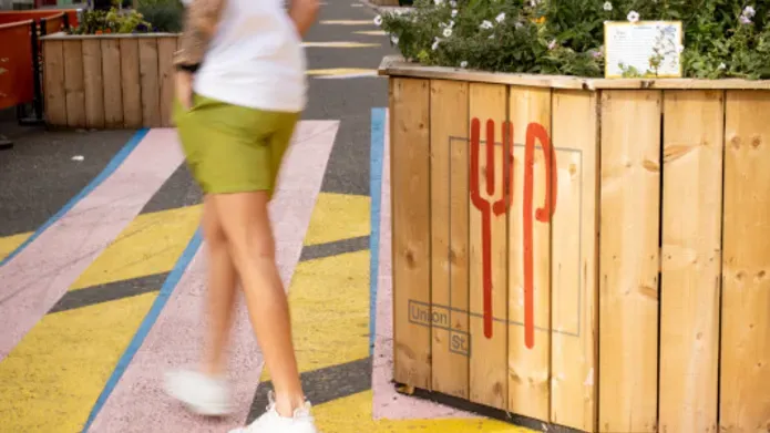 Student walking in Dundee city centre 